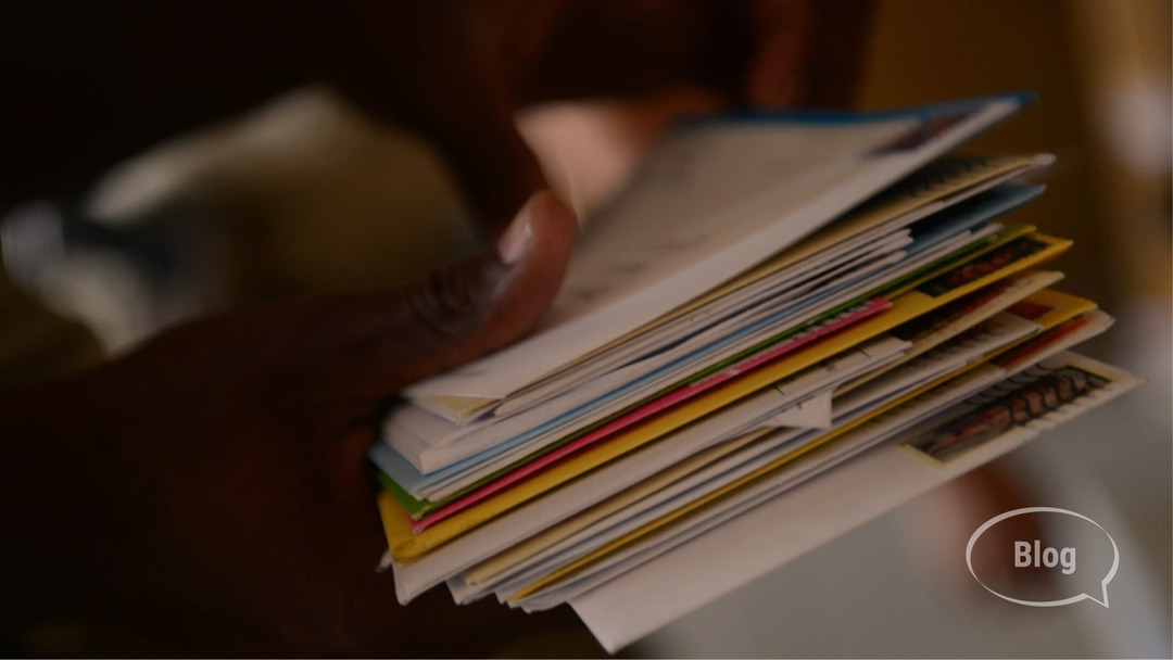 Hand holding stack of mail Hand holding stack of mail